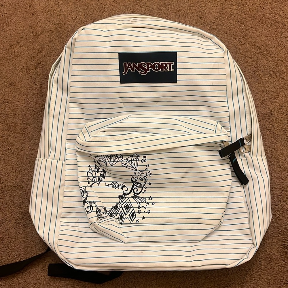 white with blue stripes Jansport backpack